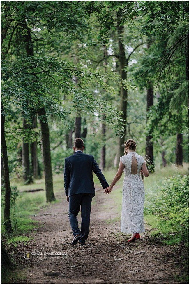 Prague Wedding Planner – Weddings, Elopements & Proposals in Prague 1 Newlyweds walking hand in hand along a forest path