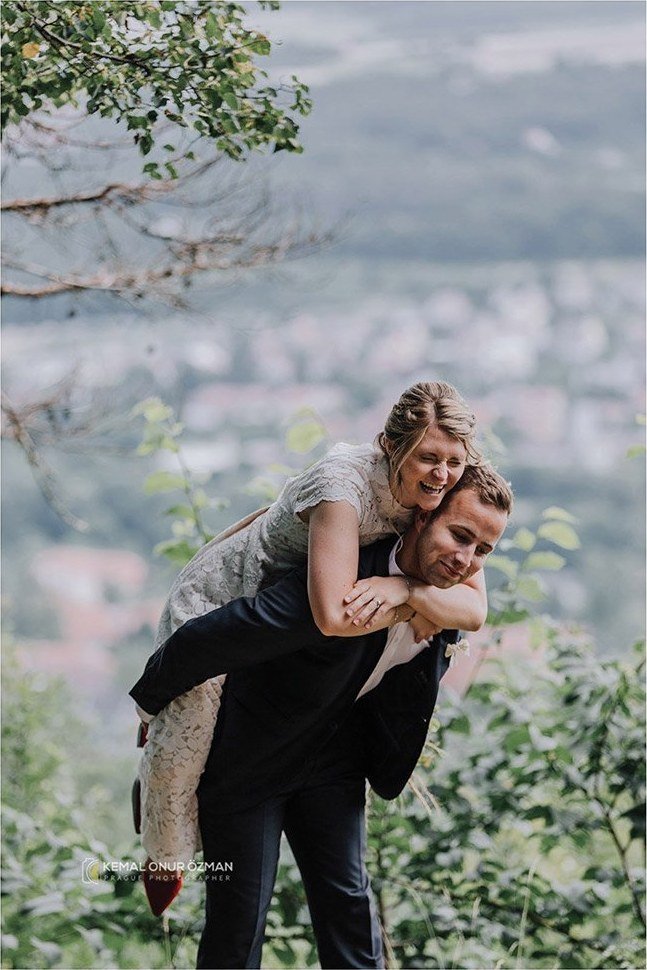 Groom giving the bride a piggyback ride